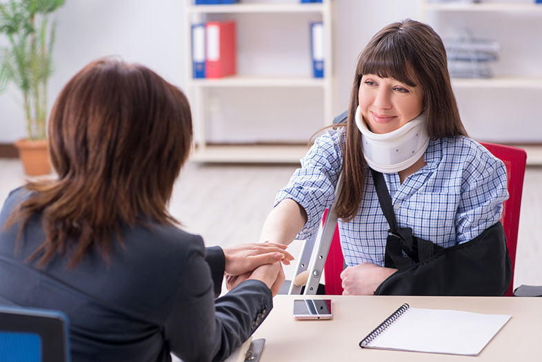 Injured employee speaking with an attorney about workers' compensation