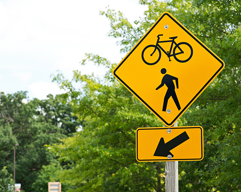 Bike and pedestrian trail traffic sign to prevent auto-pedestrian accidents