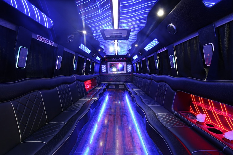 Inside a party bus with lights and an area for dancing