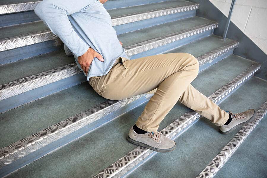 person in pain after falling down stairs