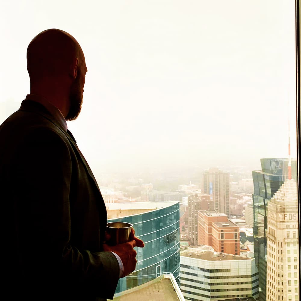 Attorney Russell Nicolet overlooking minneapolis skyline