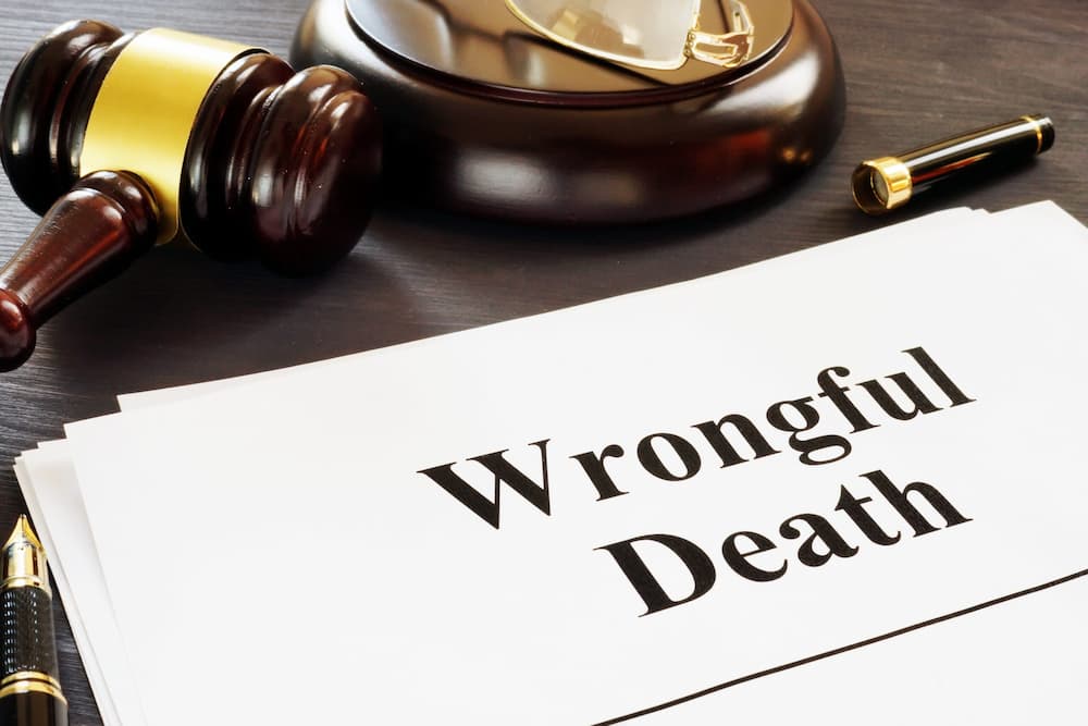 wrongful death on paper next to gavel and pen