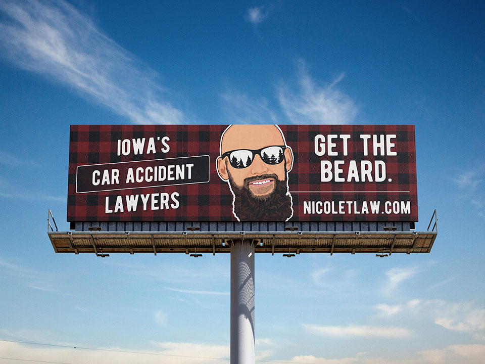 Billboard with an illustration of Russell Nicolet and words describing car accident lawyers