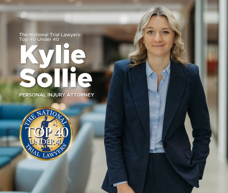 Kylie Sollie, an attorney at Nicolet Law, smiling into camera with the background being slightly blurred.