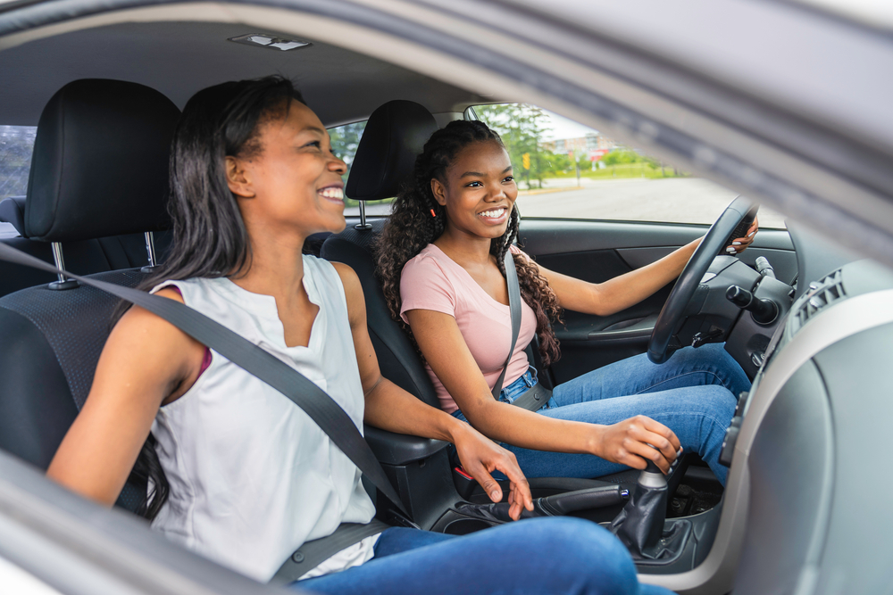 A pair of teens taking a car for a drive