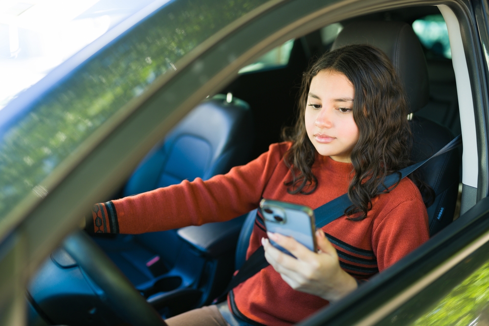 New driver using phone after accident