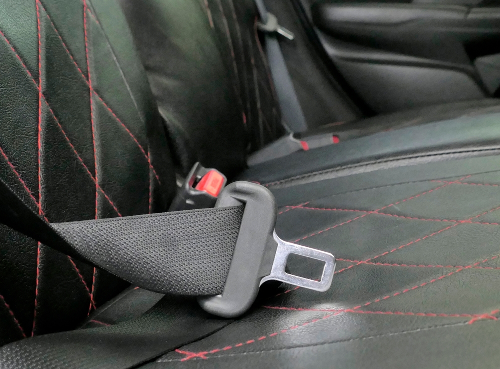 Stylized picture of an unbuckled backseat seatbelt