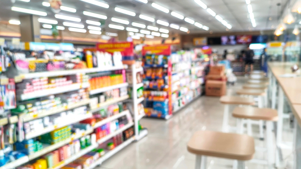 Out-of-focus view down a grocery store aisle