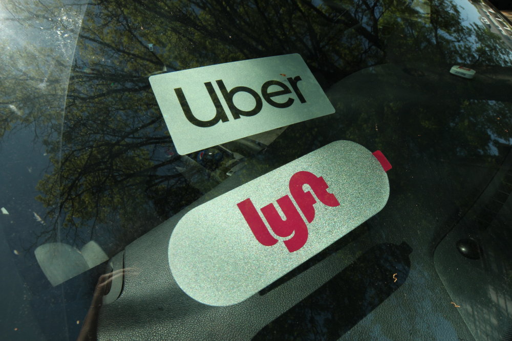 Uber and Lyft stickets in window of rideshare driver
