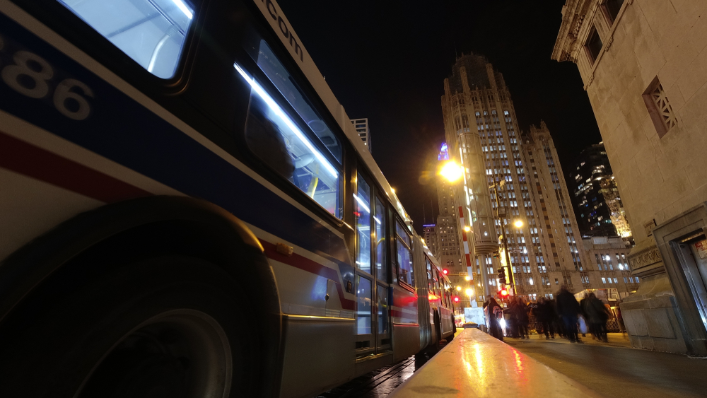 CTA bus on Chicago street at night