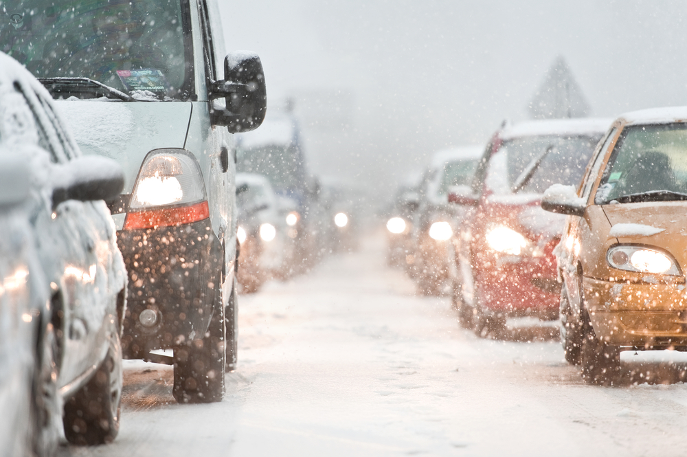 Cars in traffic on a snowing day