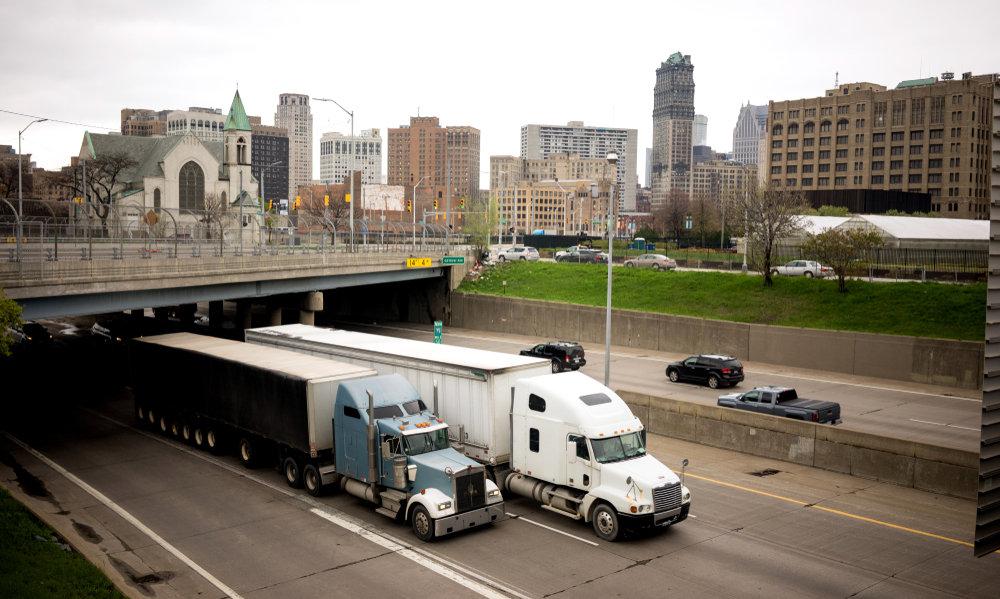Semi trucks on interstate arterial around Detroit, Michigan