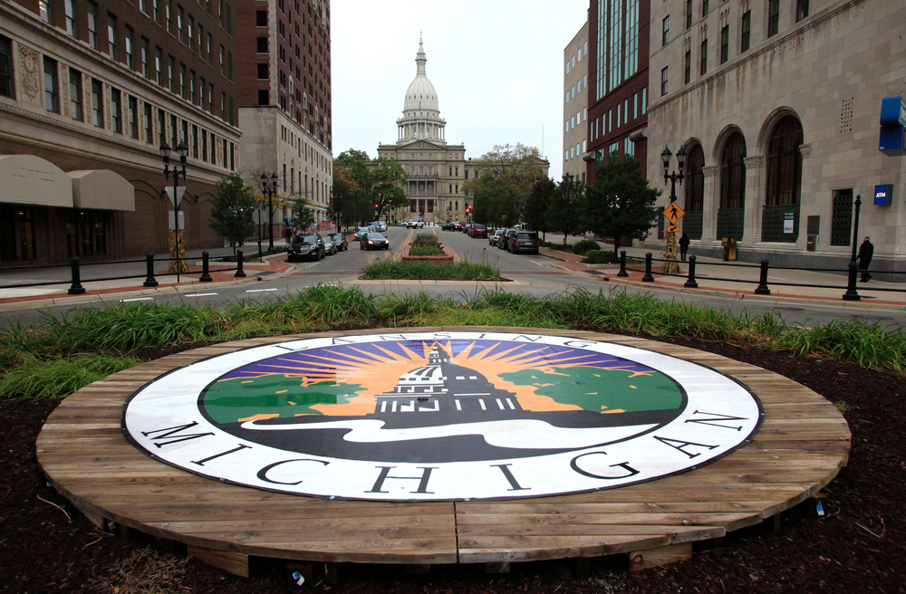 View of the state seal and capitol building in Lansing, Michigan